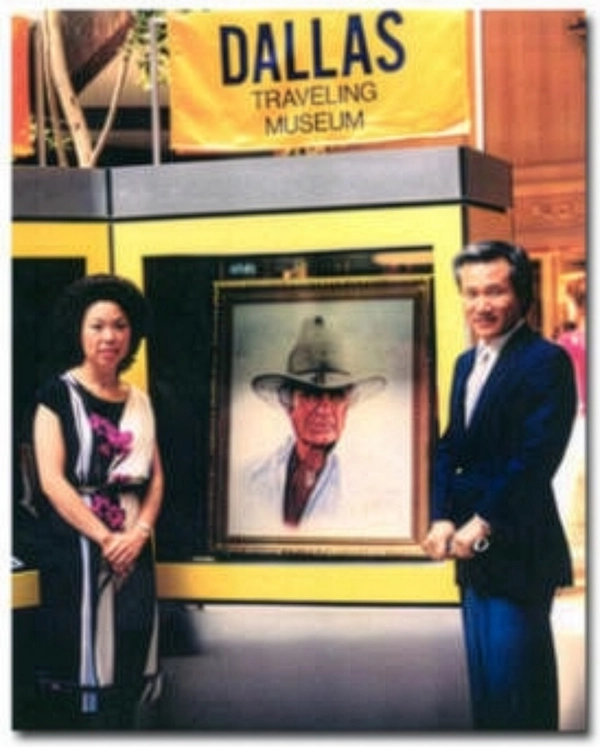 Ro Kim displaying the Jock Ewing portrait